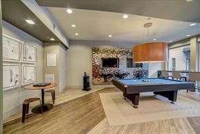 San Antonio apartment for rent - A room with a pool table and a fireplace.