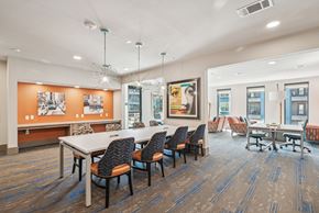 Mckinney apartment for rent - A conference room with a long table and chairs.