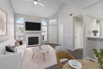 Oklahoma City apartment for rent - a living room with white furniture and a fireplace