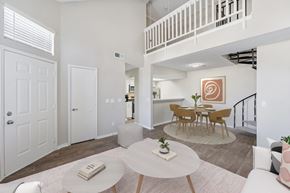 Oklahoma City apartment for rent - a living room with a dining room and a staircase