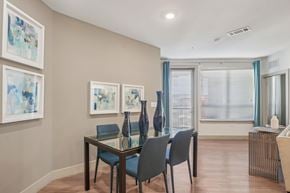 San Antonio apartment for rent - A dining room with a glass table and chairs.