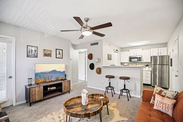 Hendersonville apartment for rent - A living room with a brown coffee table and a painting on the wall.
