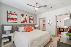 San Antonio apartment for rent - A bedroom with a large bed and a ceiling fan.
