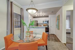 New Braunfels apartment for rent - a dining room and kitchen with a glass table and chairs