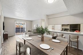 Mesquite apartment for rent - A dining room with a wooden table set for two.