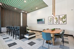 Fort Worth apartment for rent - A dining room with a wooden table surrounded by chairs.