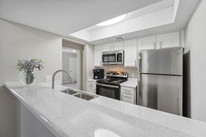 Oklahoma City apartment for rent - the preserve at ballantyne commons apartment kitchen with stainless steel appliances