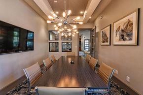 Austin apartment for rent - A conference room with a long table and chairs.