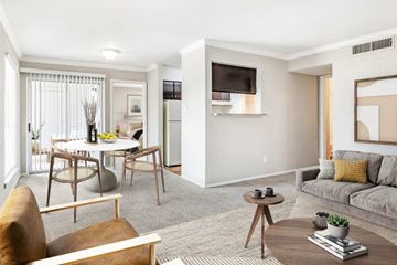 Cypress apartment for rent - A living room with a grey couch and a wooden coffee table.