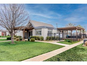 Denton townhouse for rent - the front of a house with a yard and a gazebo