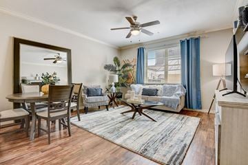 Hurst apartment for rent - a living room with a couch and a dining room table