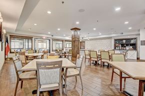 Hurst apartment for rent - the dining room at our restaurant with tables and chairs