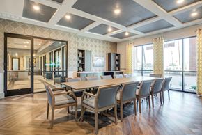 Euless apartment for rent - A conference room with a long table and chairs.