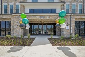 Waxahachie apartment for rent - a building with balloons in front of it