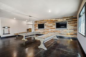 Burleson apartment for rent - a game room with two pool tables and two televisions