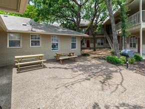 Weatherford apartment for rent - A small house with a porch and a picnic table.