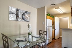 Austin apartment for rent - A dining room with a glass table and chairs.