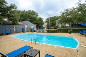 Denton apartment for rent - our apartments have a swimming pool with chairs and tables
