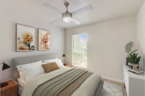 Dallas apartment for rent - a bedroom with a bed and a ceiling fan