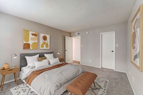 Houston apartment for rent - a bedroom with a large bed and a closet