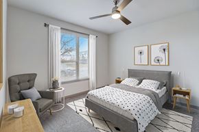 Forney apartment for rent - a bedroom with a bed and a ceiling fan