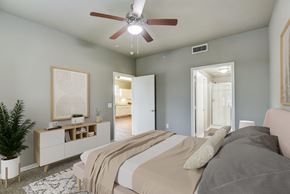Forney apartment for rent - a bedroom with a large bed and a ceiling fan