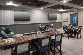 Library and game room with card tables