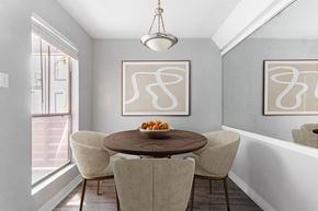 Houston apartment for rent - Dining nook with round table and upholstered chairs at 2151 Kirkwood Apartments, Houston, TX