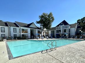 Houston apartment for rent - Swimming pool with surrounding residential buildings at 2151 Kirkwood Apartments, Houston, Texas