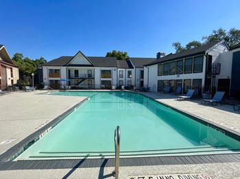 Resort style swimming pool with surrounding deck