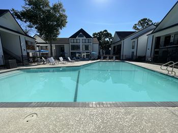 Large outdoor swimming pool with surrounding deck