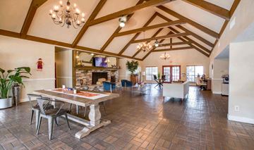 Houston apartment for rent - A large open living room with a dining table and chairs.