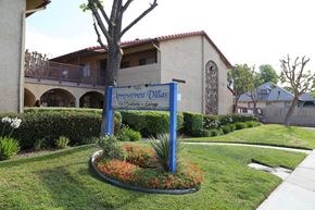 Fontana apartment for rent - A sign for Arrowcrest Olive reads "1400 S. Orange Ave, Garden Grove.".