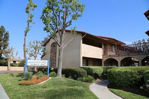 Fontana apartment for rent - A building with a sign that says "Academy of Woodland".