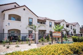Riverside apartment for rent - A sign that says Grand Villas in front of a building.
