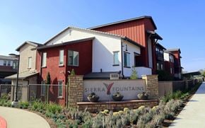 Fontana apartment for rent - A red and white building with a sign that says Sierra Fountains.