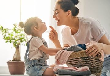 Fontana apartment for rent - A woman and a child are sitting together, with the woman holding a basket of clothes.