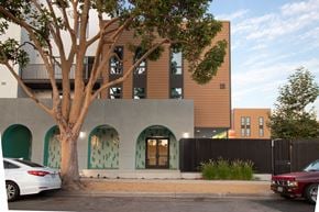 Santa Ana townhouse for rent - A modern building with a tree in front of it.