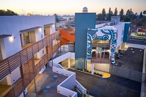 Santa Ana apartment for rent - A building with a blue and white mural on the side.