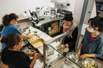 Santa Ana townhouse for rent - Four women are working in a kitchen.