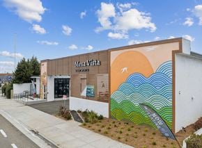 Costa Mesa apartment for rent - A wall with a mural of waves and a sun.