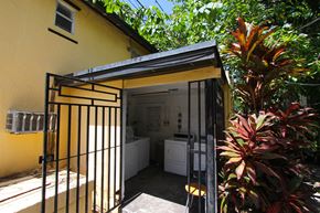 Miami apartment for rent - a view of the kitchen and laundry room from the courtyard