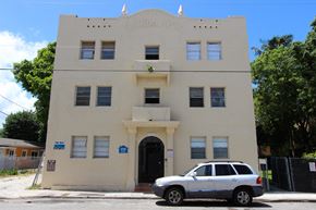 Miami apartment for rent - a white car parked in front of a white building