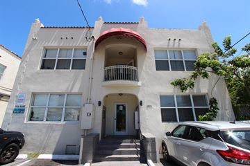 Miami apartment for rent - A two-story building with a balcony on the second floor is for rent.