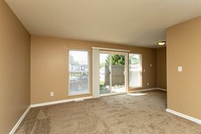 Columbus apartment for rent - A room with carpeted floor and sliding glass doors.