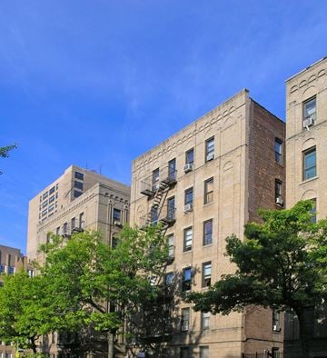 Bronx apartment for rent - A tall building with a fire escape on the side.