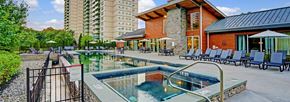 Cherry Hill apartment for rent - A large outdoor swimming pool with a hot tub in the middle of it.
