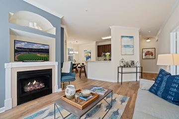 Wakefield apartment for rent - A living room with a fireplace and a painting on the wall.