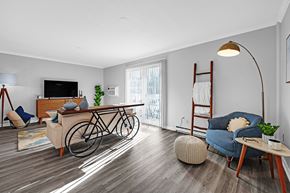 Shrewsbury apartment for rent - A living room with a bicycle leaning against the wall at Ashford Crossing, Shrewsbury, MA