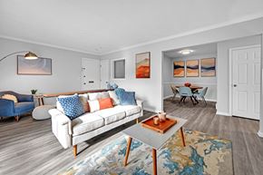 Shrewsbury apartment for rent - A living room with a white couch and a blue chair at Ashford Crossing, Shrewsbury, MA